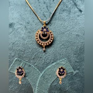 Gold tone Crystal necklace with matching earrings.